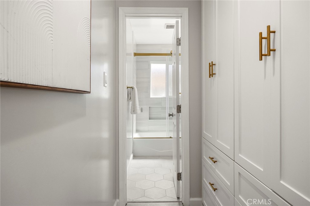 11629 185th Street Artesia, CA 90701 - Photo 9 of 20 a bathroom with a glass shower door