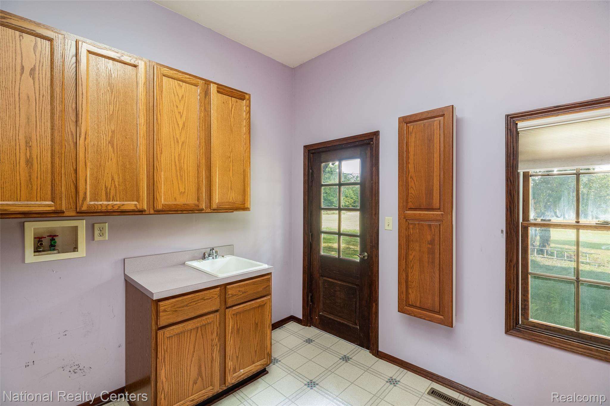 9155 Six Mile Road Northville, MI 48168 - Photo 30 of 40 30.Laundry