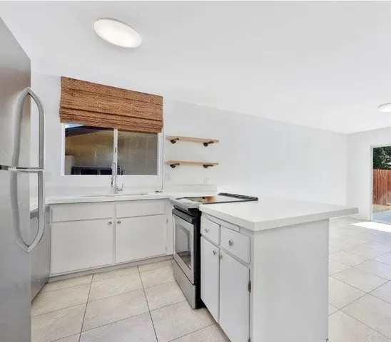 a kitchen with a stove and a microwave