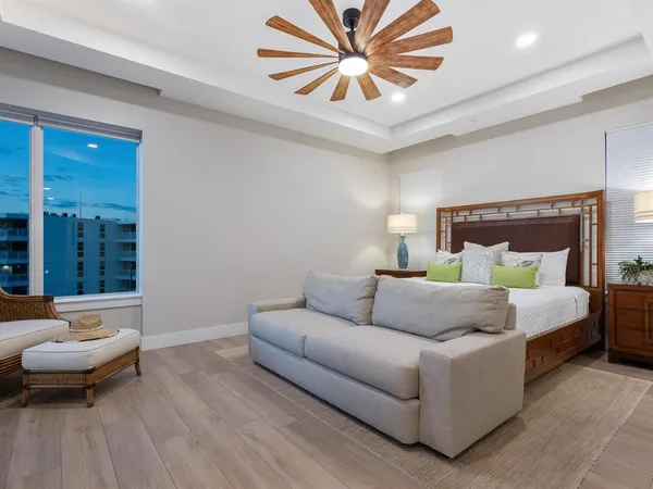 a bedroom with a large bed and a window