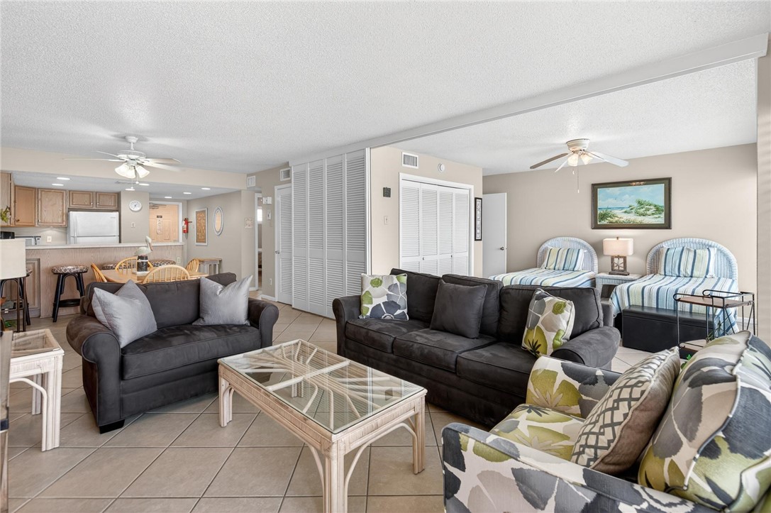 14810 Windward Drive, Unit 402 Corpus Christi, TX 78418 - Photo 15 of 39 a living room with furniture and a view of kitchen