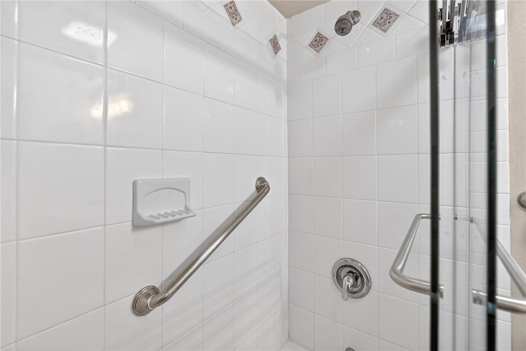 14810 Windward Drive, Unit 402 Corpus Christi, TX 78418 - Photo 19 of 39 a bathroom with a shower