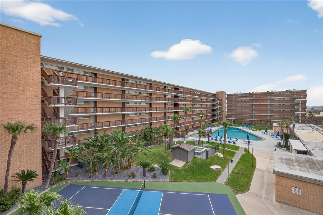 14810 Windward Drive, Unit 402 Corpus Christi, TX 78418 - Photo 2 of 39 a view of swimming pool with outdoor seating