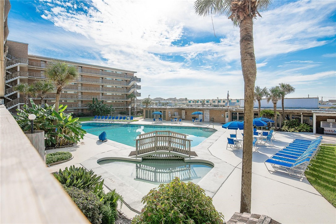 14810 Windward Drive, Unit 402 Corpus Christi, TX 78418 - Photo 30 of 39 a view of a swimming pool with a patio