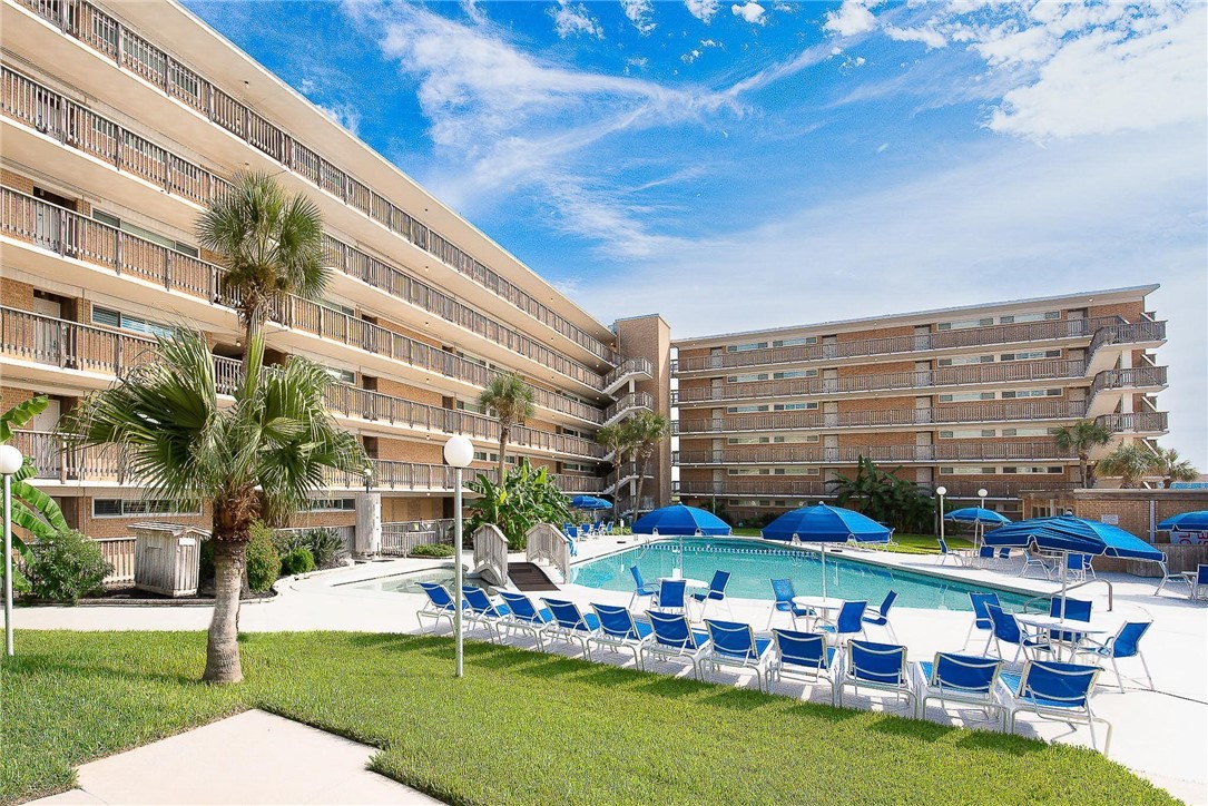 14810 Windward Drive, Unit 402 Corpus Christi, TX 78418 - Photo 33 of 39 a front view of building with yard