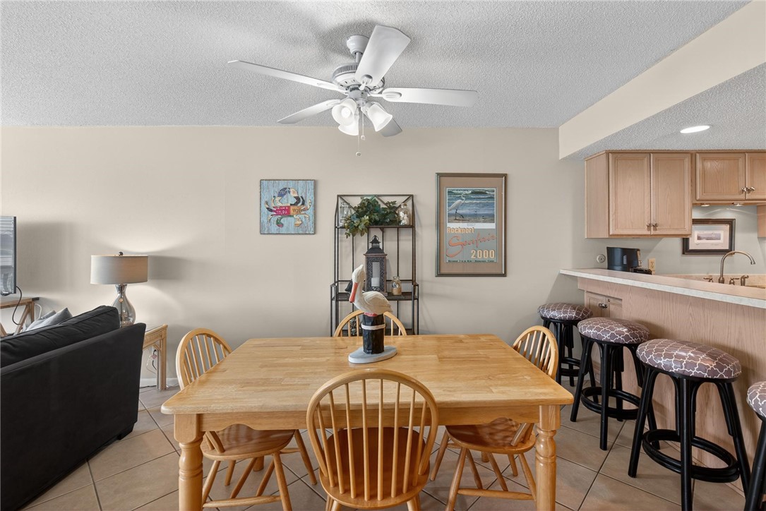 14810 Windward Drive, Unit 402 Corpus Christi, TX 78418 - Photo 10 of 39 a very nice looking dining room with furniture