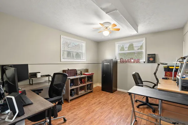 a workspace with furniture and wooden floor