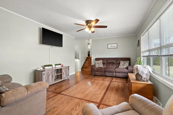 a living room with furniture and a flat screen tv