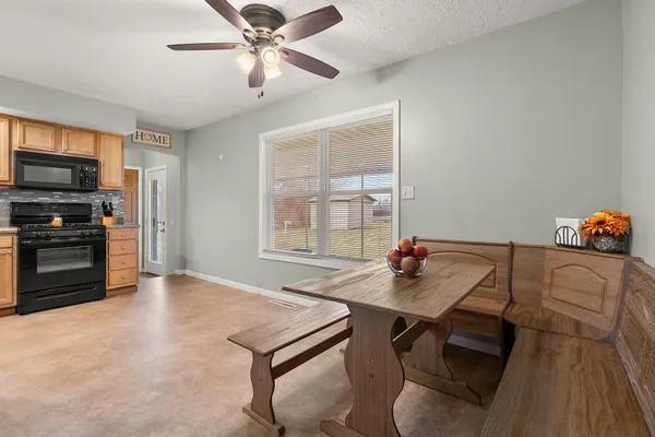 a workspace with furniture window and wooden floor