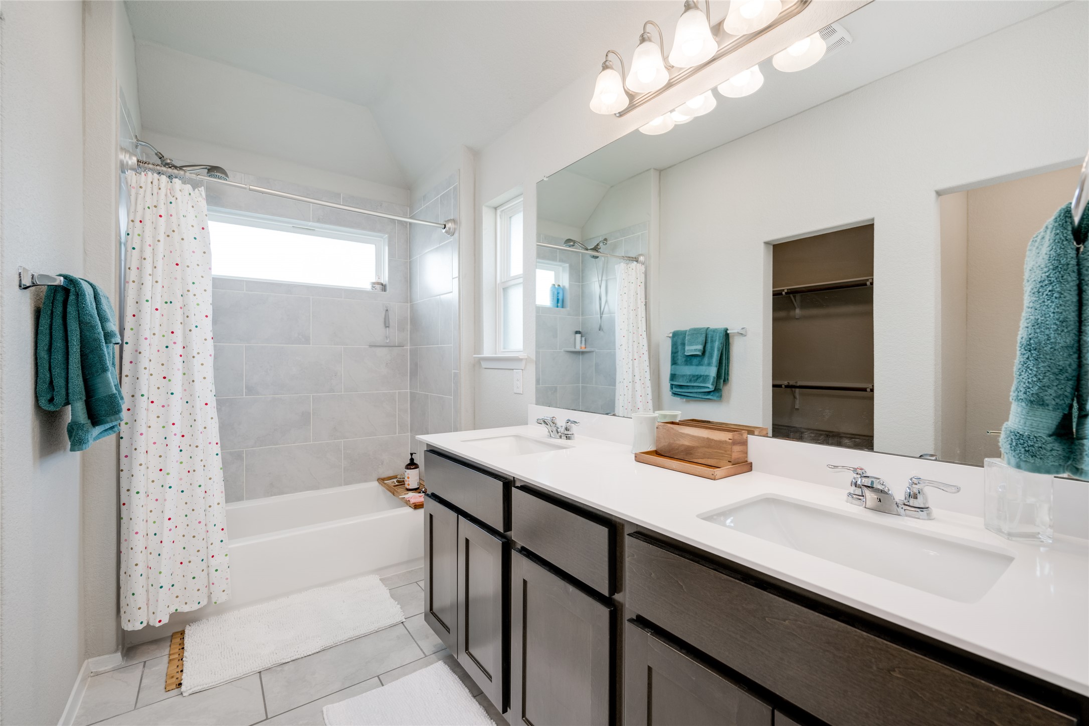 7948 Castelardo Place Round Rock, TX 78665 - Photo 20 of 32 a bathroom with a granite countertop sink and a mirror