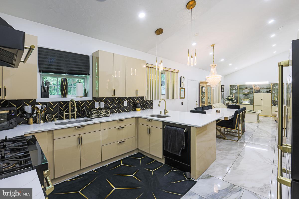 3111 Parkington Avenue Baltimore, MD 21215 - Photo 1 of 47 a kitchen with a sink and cabinets