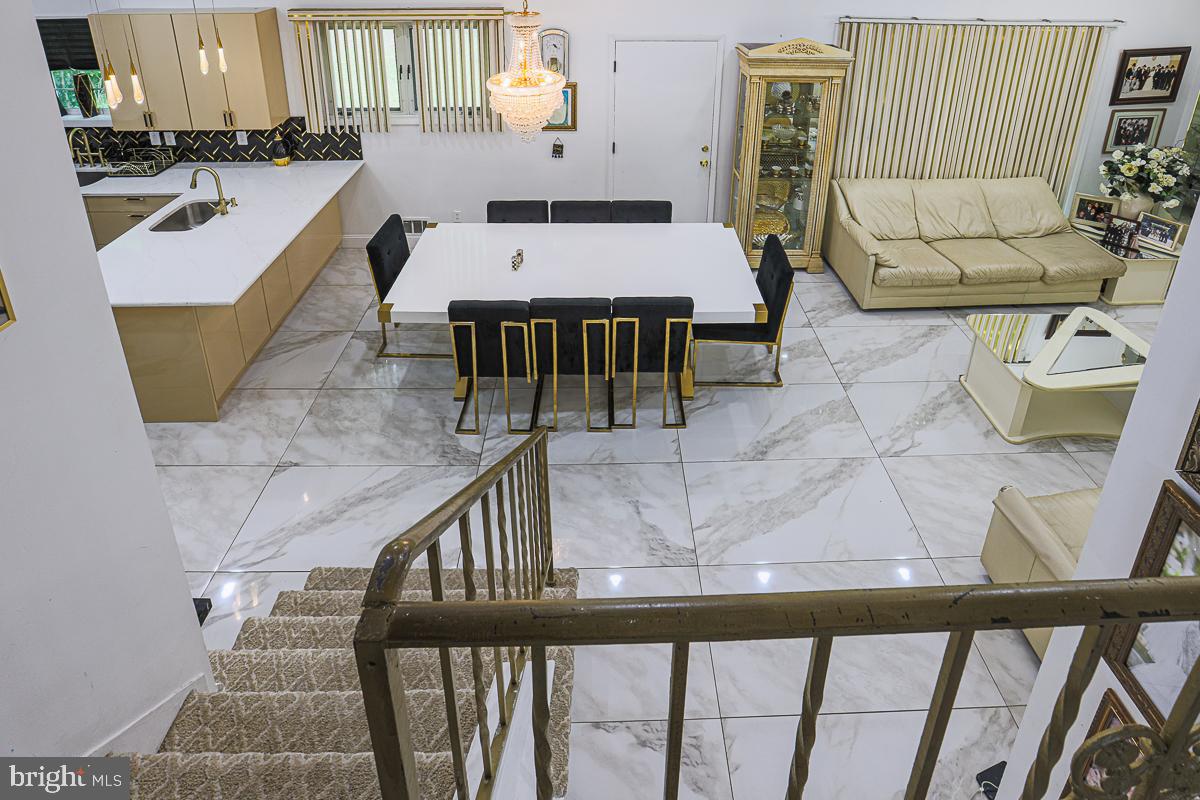 3111 Parkington Avenue Baltimore, MD 21215 - Photo 16 of 47 a living room with furniture and a table