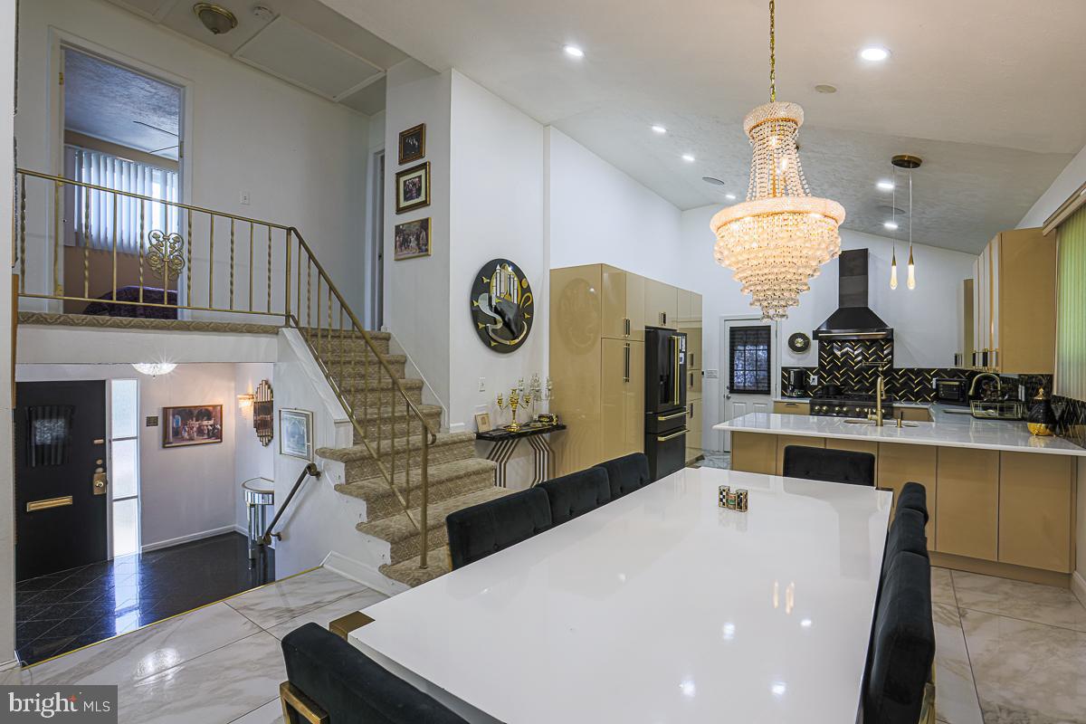 3111 Parkington Avenue Baltimore, MD 21215 - Photo 18 of 47 a large kitchen with a table and a large window