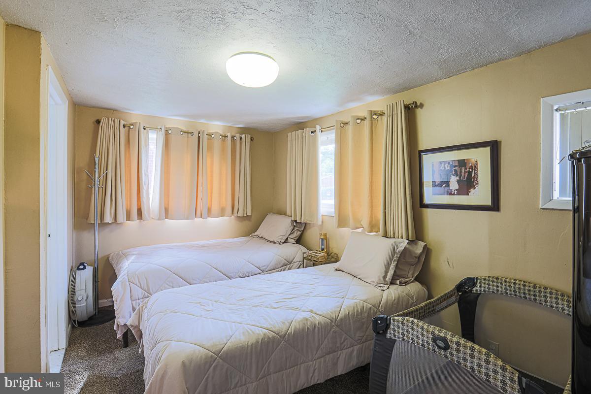 3111 Parkington Avenue Baltimore, MD 21215 - Photo 32 of 47 a bedroom with a bed and a window