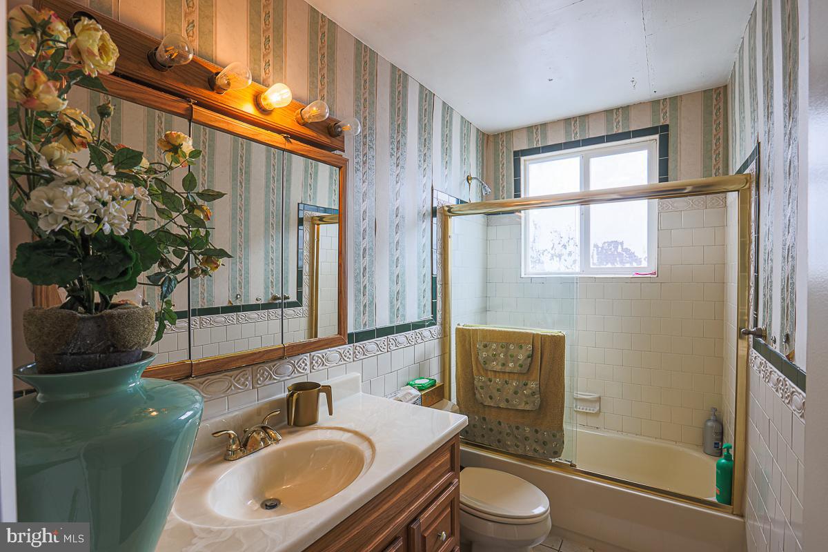 3111 Parkington Avenue Baltimore, MD 21215 - Photo 38 of 47 a bathroom with a sink toilet and shower