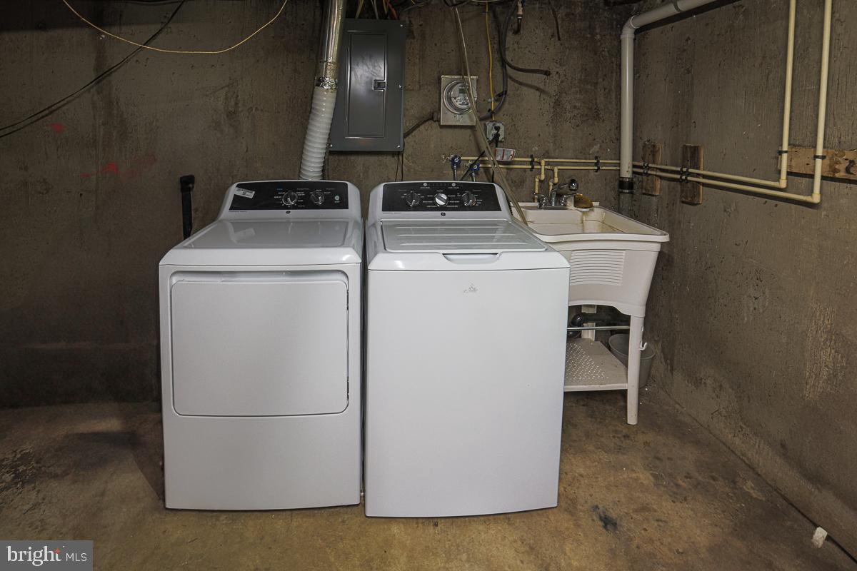 3111 Parkington Avenue Baltimore, MD 21215 - Photo 39 of 47 a utility room with dryer and washer