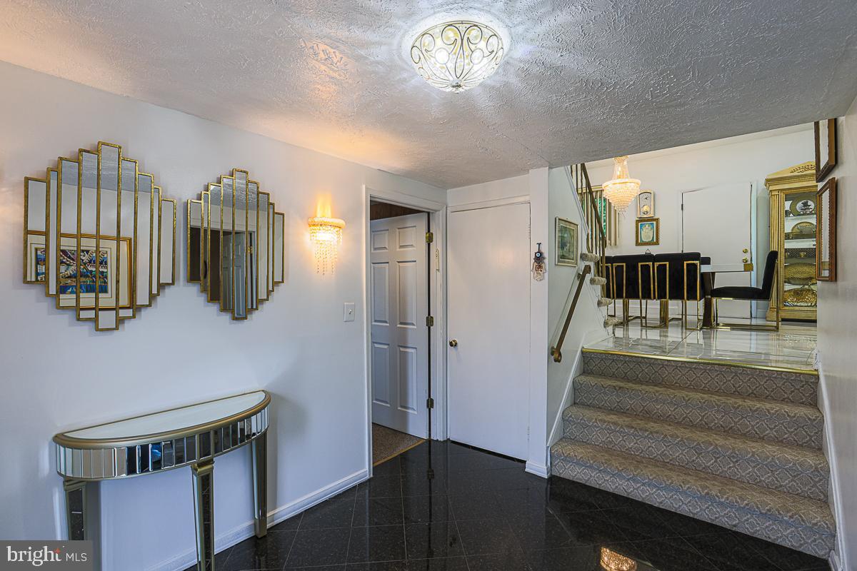 3111 Parkington Avenue Baltimore, MD 21215 - Photo 4 of 47 a view of hall way with furniture and chandelier