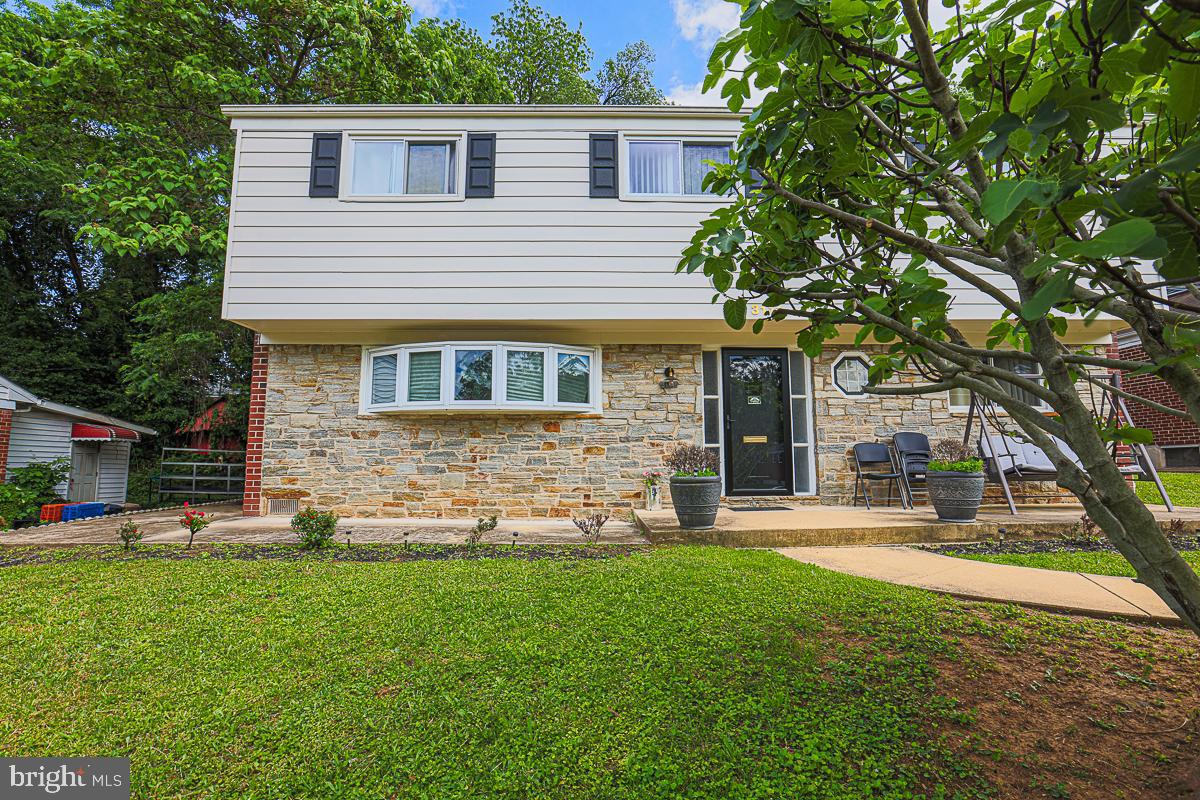 3111 Parkington Avenue Baltimore, MD 21215 - Photo 46 of 47 a view of a house with a yard and sitting area
