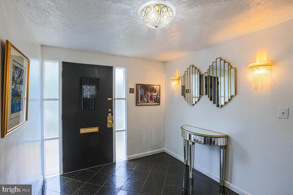 3111 Parkington Avenue Baltimore, MD 21215 - Photo 5 of 47 a view of a hallway with workspace and a window