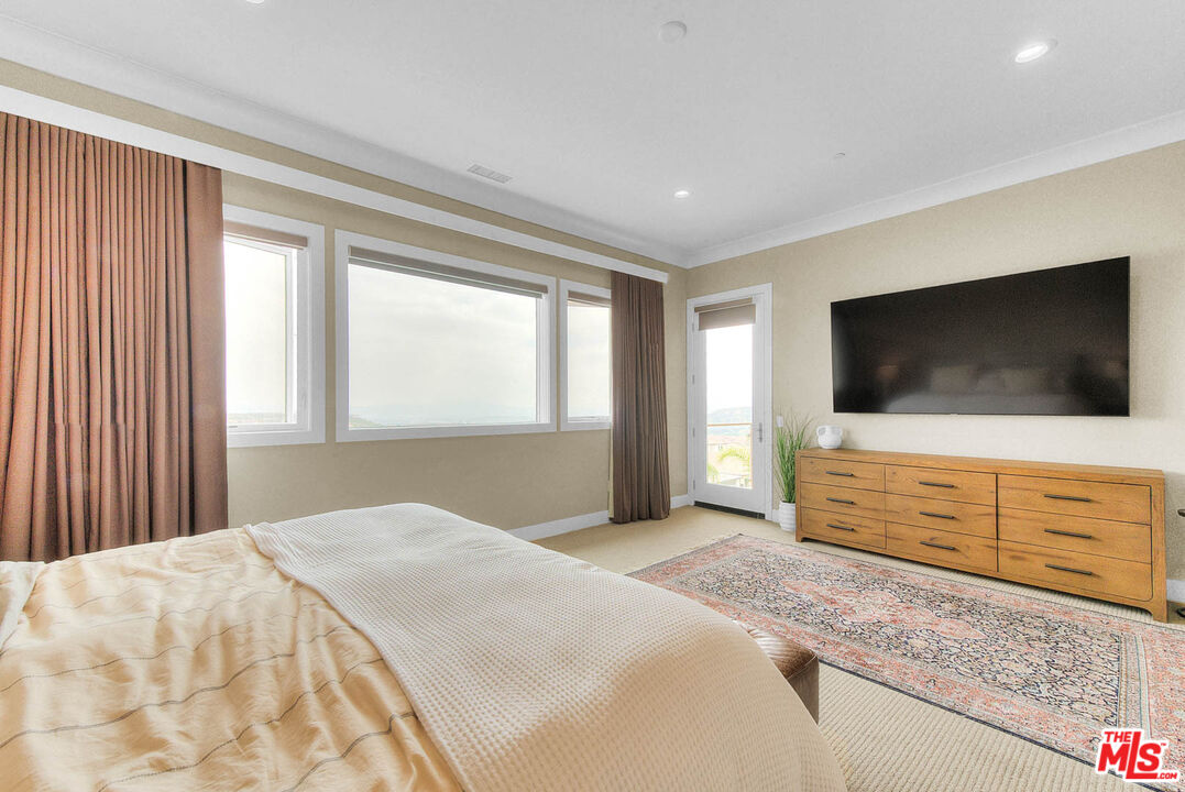 20558 Overlook Court Porter Ranch, CA 91326 - Photo 19 of 48 a bedroom with a bed and a flat screen tv