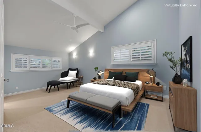 a bedroom with a bed and a couch