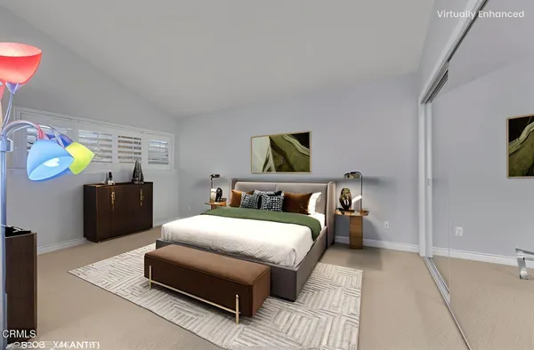 a bedroom with bed and a couch