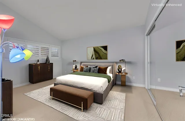 a bedroom with bed and a couch