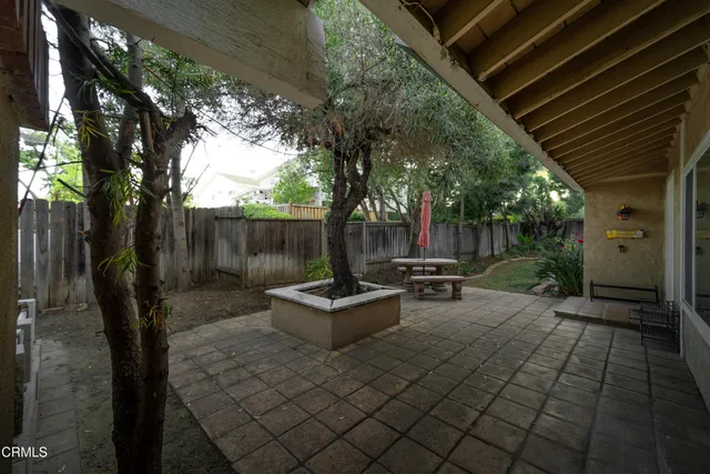 a view of a backyard with sitting area