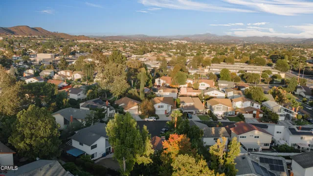 an aerial view of city and lake