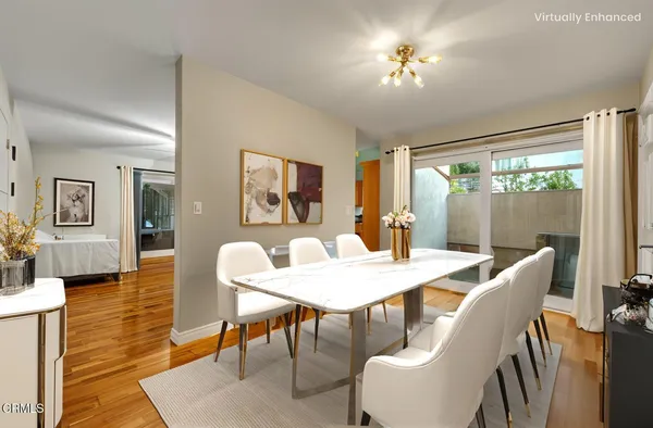 a view of a dining room with furniture window and wooden floor