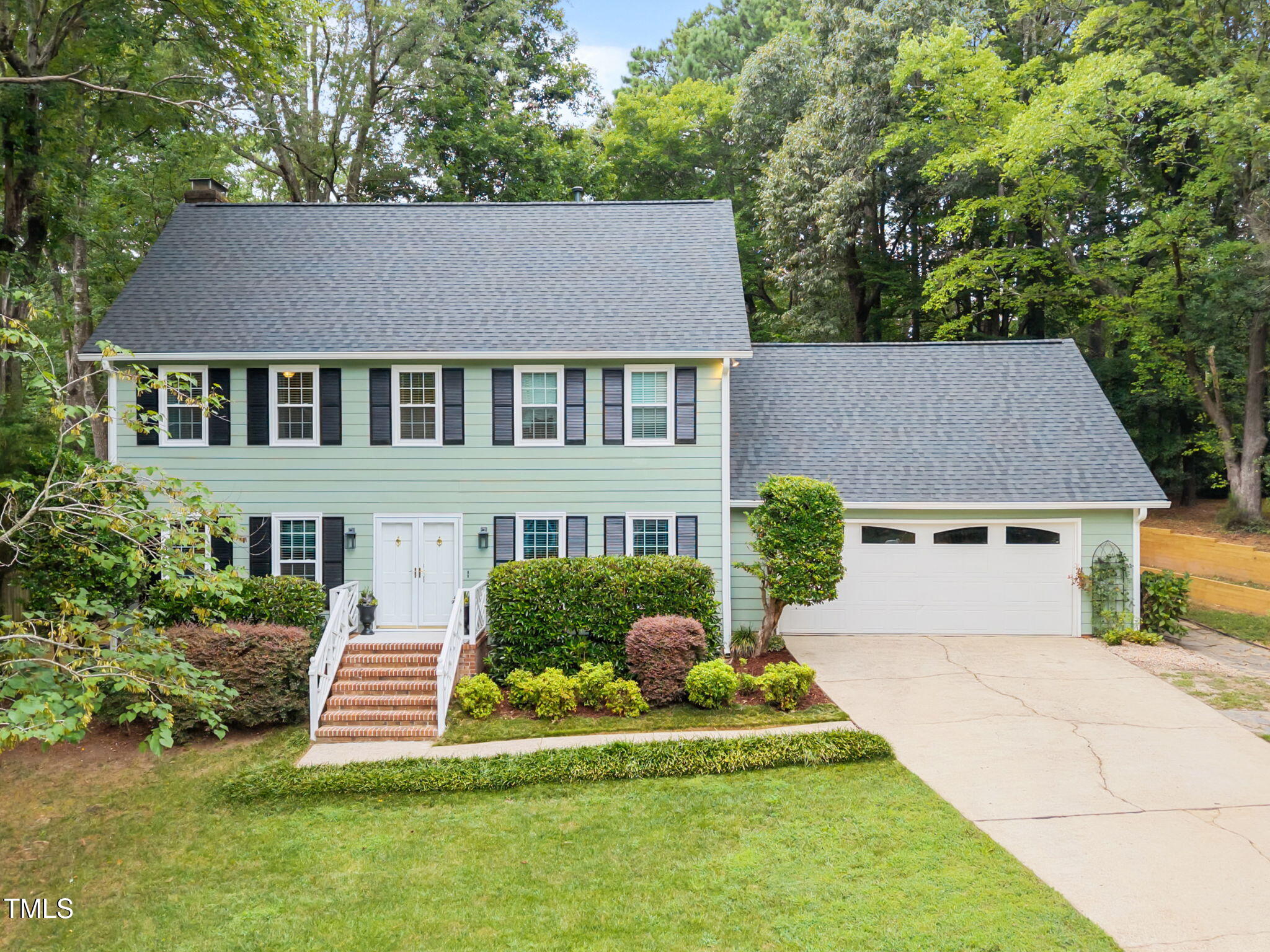 8009 Running Cedar Trail Raleigh, NC 27615 - Photo 1 of 42 front view of a house with a yard