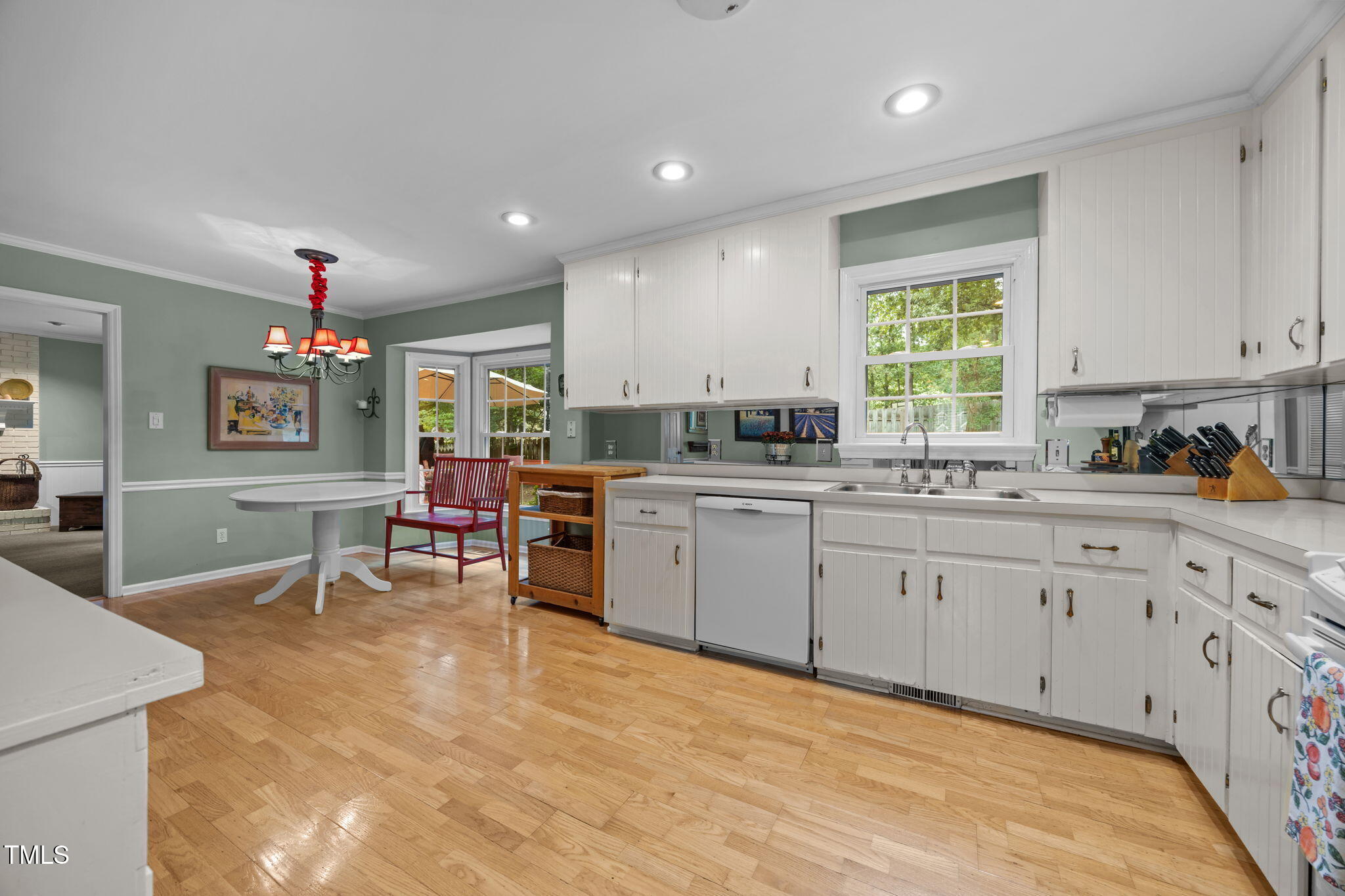 8009 Running Cedar Trail Raleigh, NC 27615 - Photo 10 of 42 a kitchen with counter top space appliances and cabinets