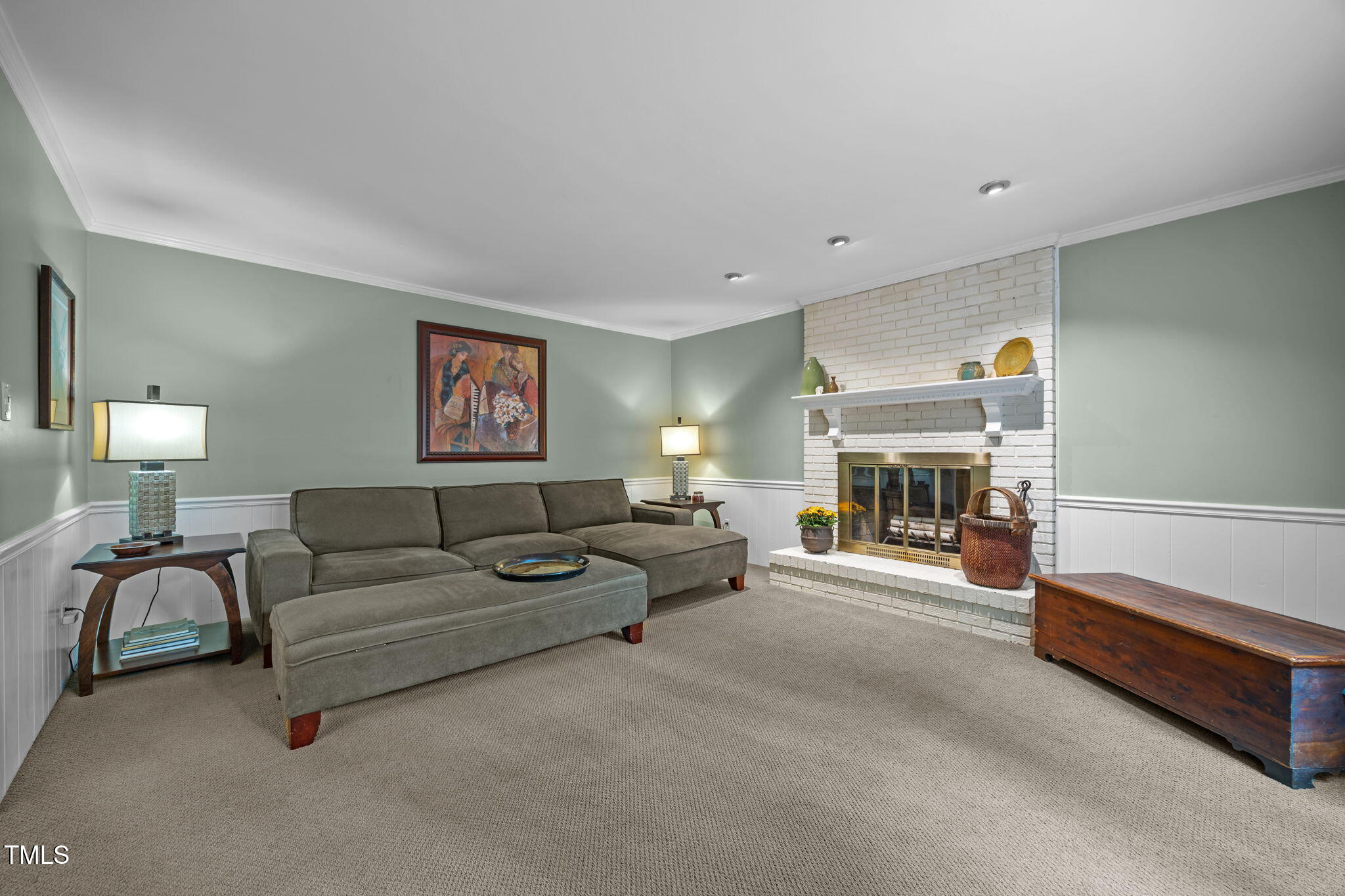 8009 Running Cedar Trail Raleigh, NC 27615 - Photo 18 of 42 a living room with furniture and a fireplace
