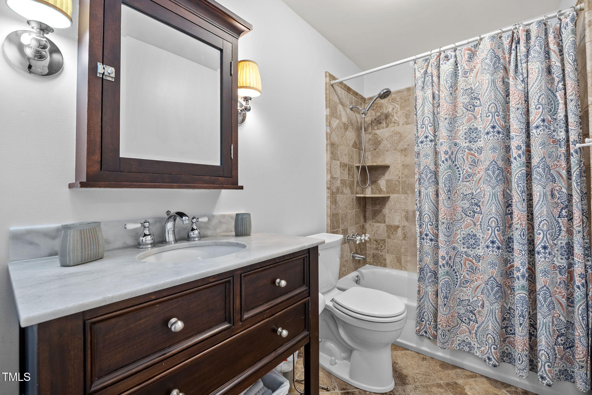 8009 Running Cedar Trail Raleigh, NC 27615 - Photo 27 of 42 a bathroom with a granite countertop toilet sink and mirror