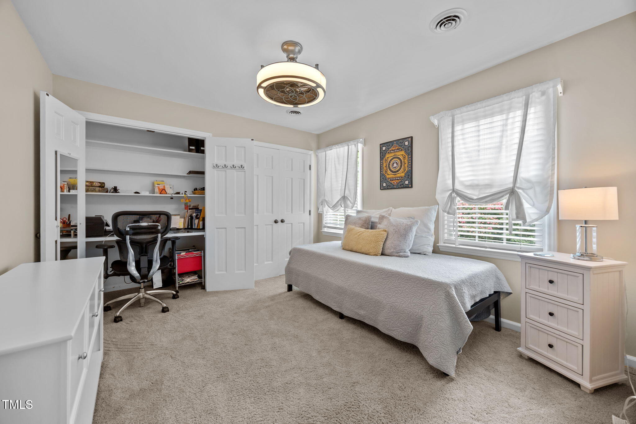 8009 Running Cedar Trail Raleigh, NC 27615 - Photo 28 of 42 a bedroom with bed and a large window
