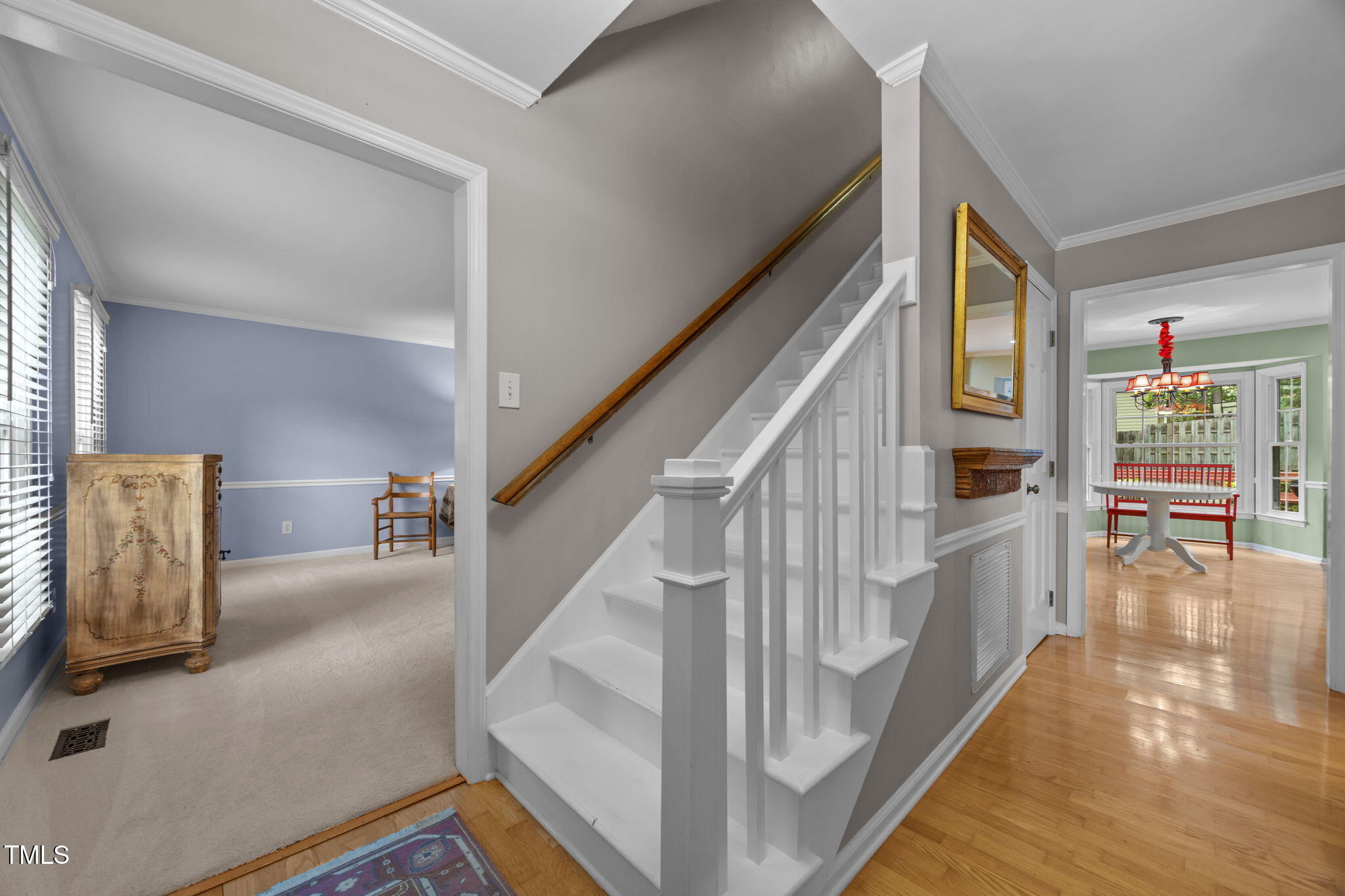 8009 Running Cedar Trail Raleigh, NC 27615 - Photo 5 of 42 a view of entryway and hall with wooden floor