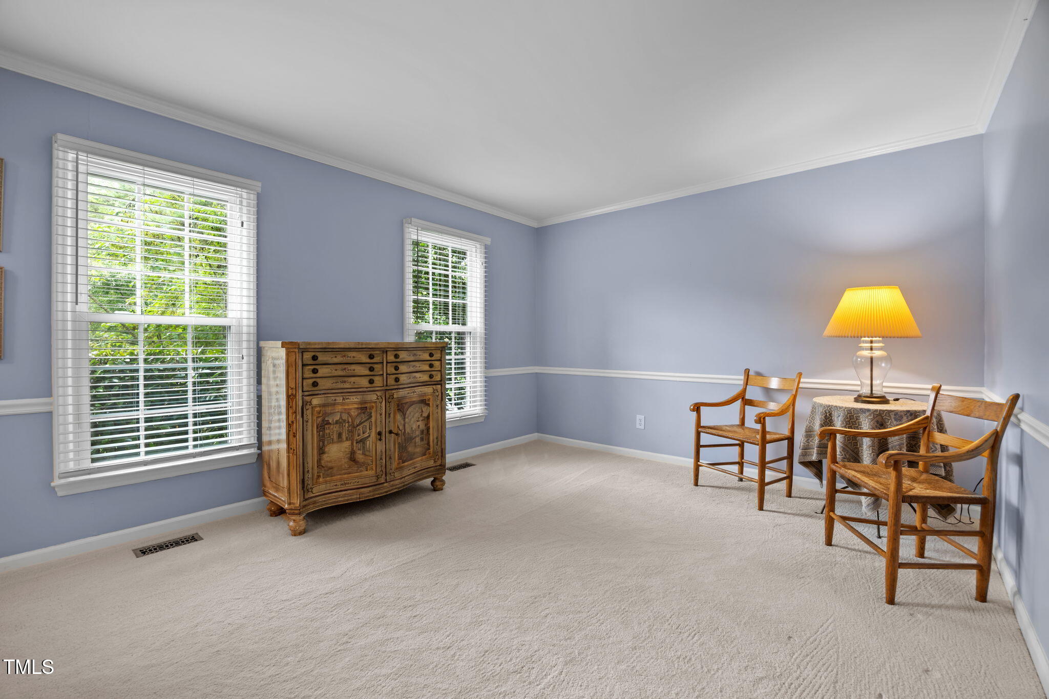 8009 Running Cedar Trail Raleigh, NC 27615 - Photo 7 of 42 a view of a livingroom with furniture and a window