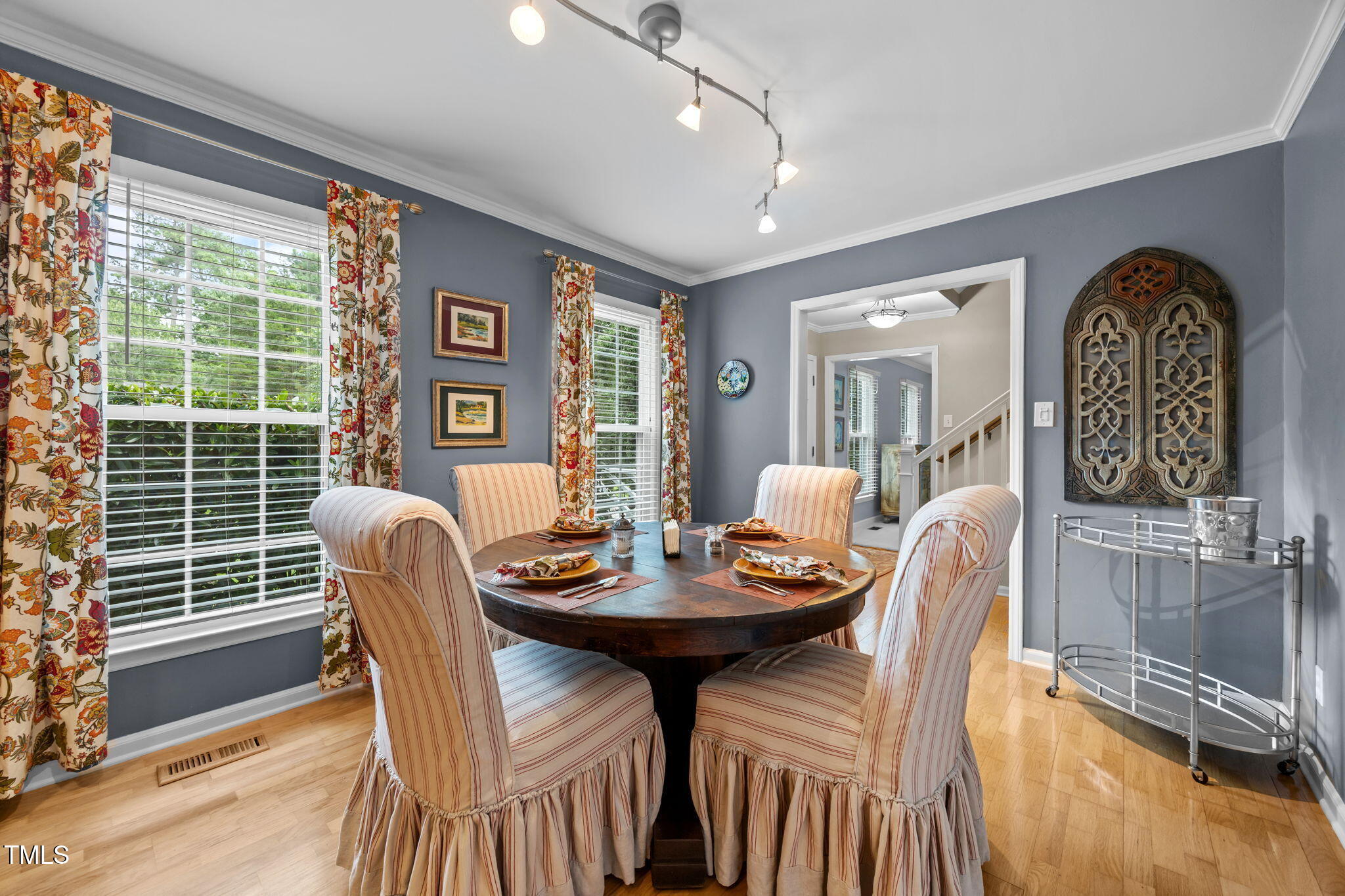 8009 Running Cedar Trail Raleigh, NC 27615 - Photo 9 of 42 a view of a dining room with furniture and window
