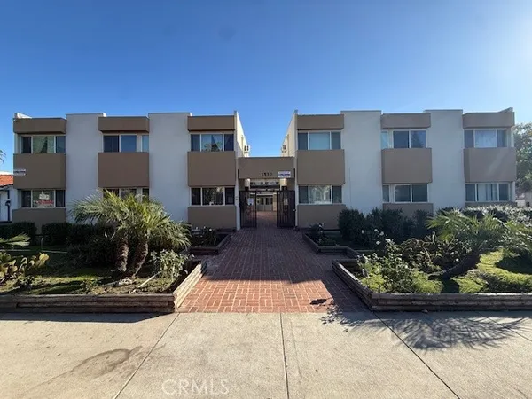 a front view of a multi story residential apartment building