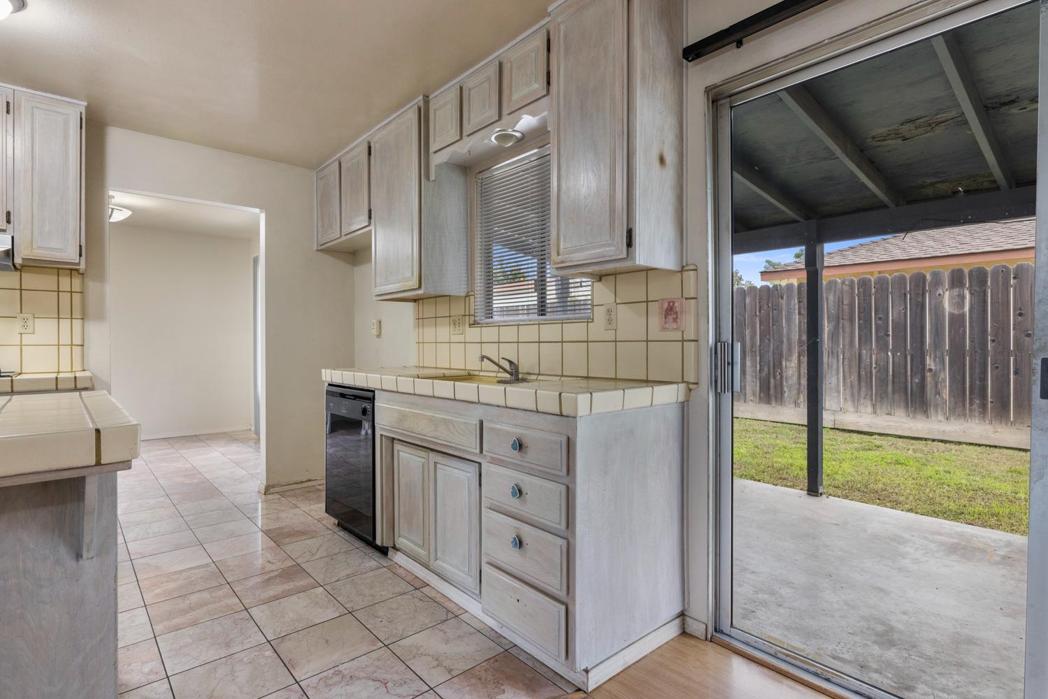 1205 Kara Lane Modesto, CA 95355 - Photo 13 of 39 a bathroom with a granite countertop sink and a mirror