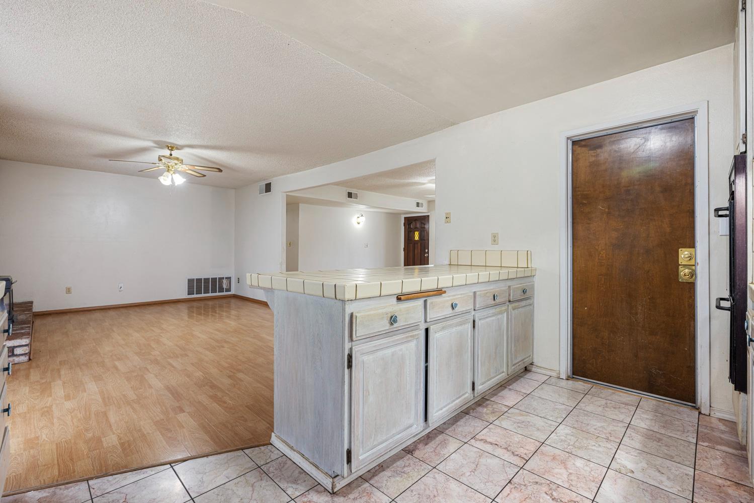 1205 Kara Lane Modesto, CA 95355 - Photo 16 of 39 a bathroom with a sink a mirror and a vanity