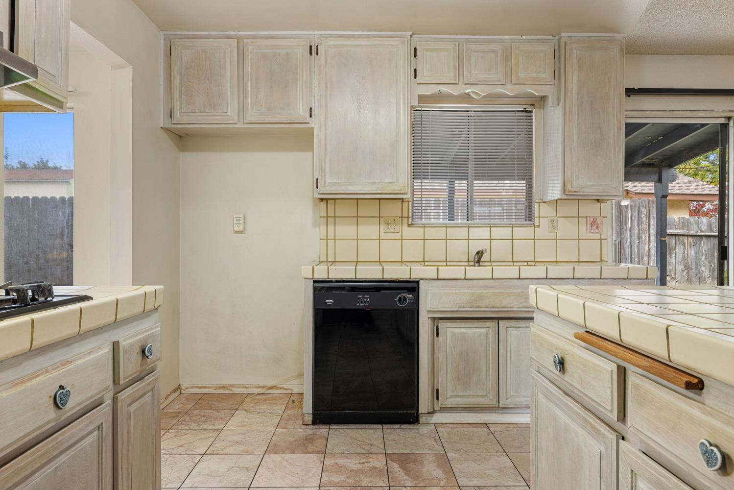 1205 Kara Lane Modesto, CA 95355 - Photo 17 of 39 a kitchen with cabinets and appliances
