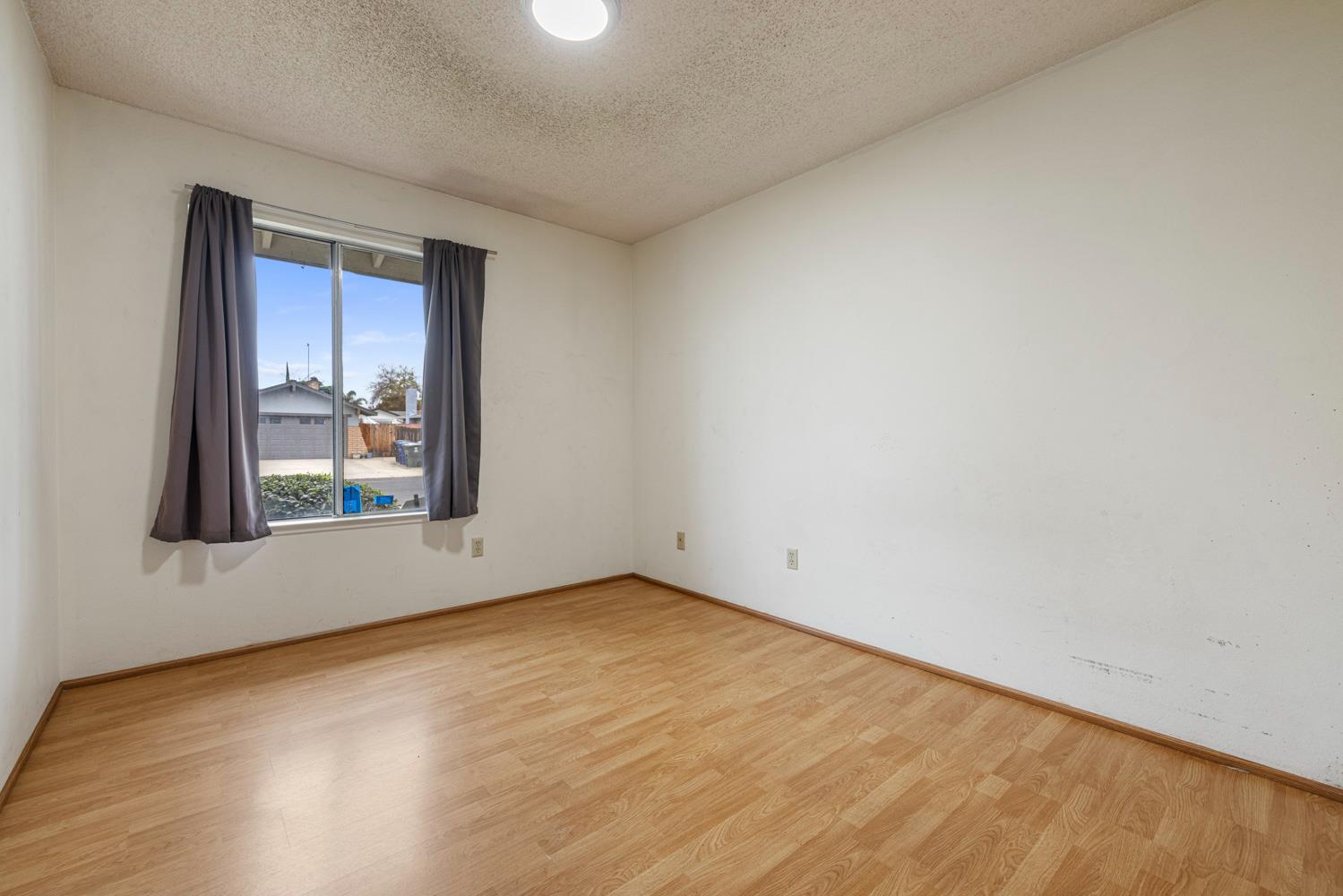 1205 Kara Lane Modesto, CA 95355 - Photo 21 of 39 an empty room with window