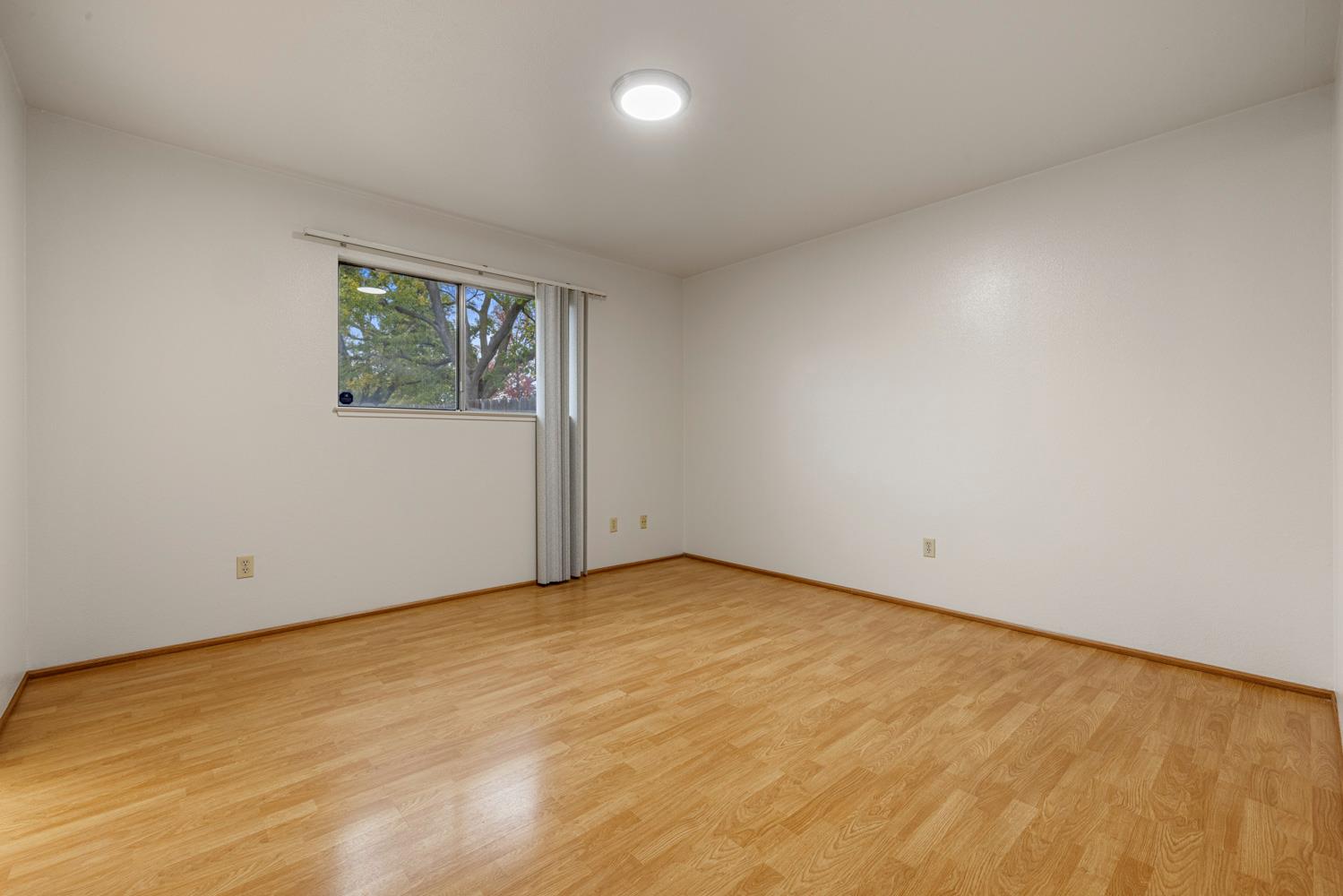 1205 Kara Lane Modesto, CA 95355 - Photo 25 of 39 an empty room with a empty space and window