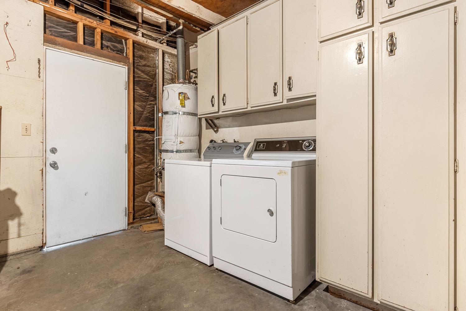 1205 Kara Lane Modesto, CA 95355 - Photo 35 of 39 a utility room with dryer and washer
