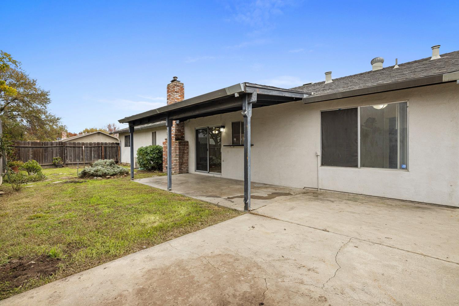 1205 Kara Lane Modesto, CA 95355 - Photo 36 of 39 a front view of a house with a yard