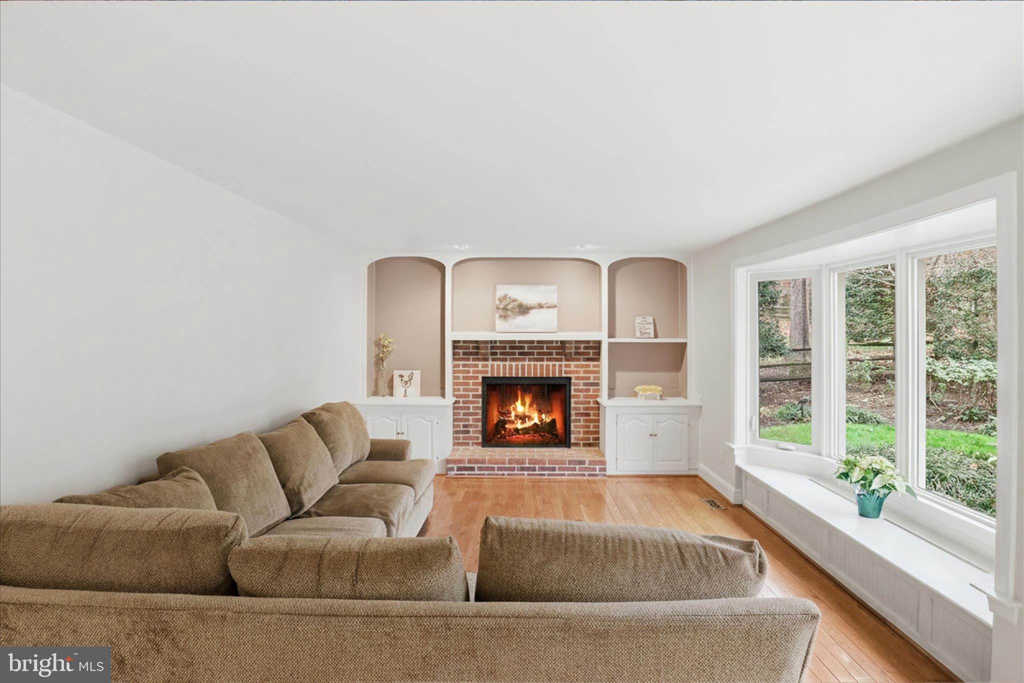 6809 Spout Lane Fairfax Station, VA 22039 - Photo 17 of 81 a living room with furniture and a fireplace