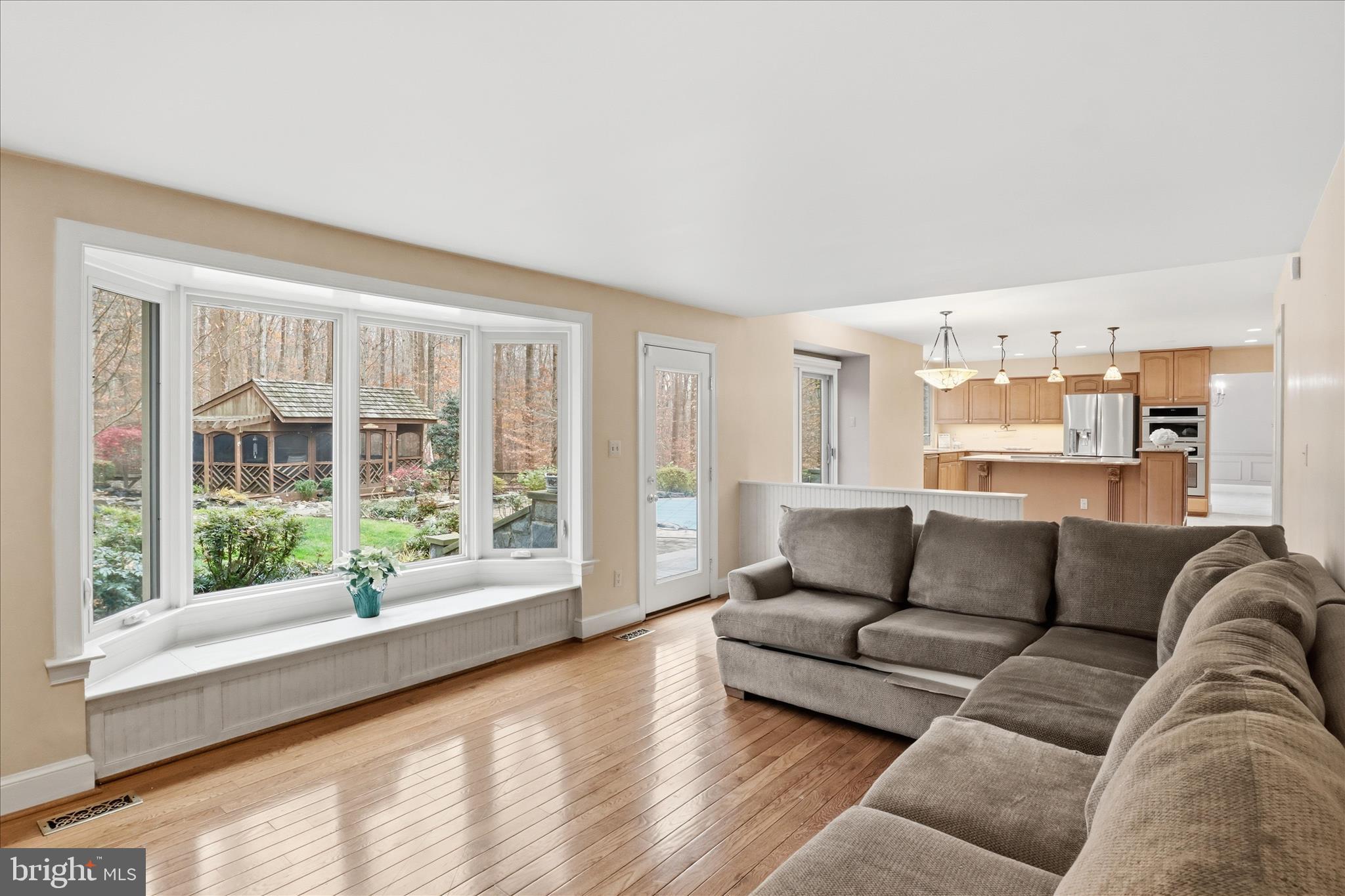 6809 Spout Lane Fairfax Station, VA 22039 - Photo 18 of 81 a living room with furniture and a large window
