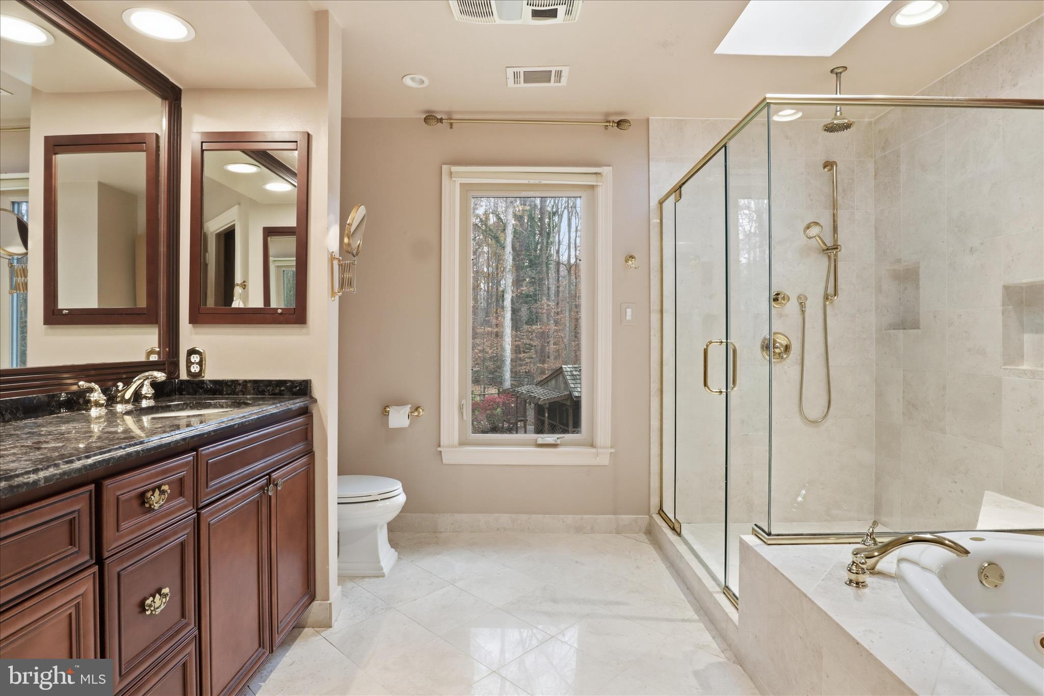 6809 Spout Lane Fairfax Station, VA 22039 - Photo 27 of 81 a bathroom with a double vanity sink toilet and shower