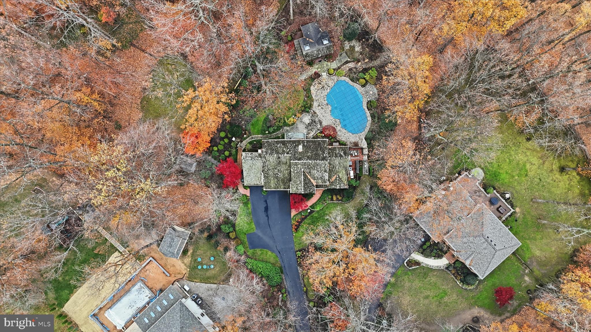 6809 Spout Lane Fairfax Station, VA 22039 - Photo 68 of 81 an aerial view of a house with a yard and large trees
